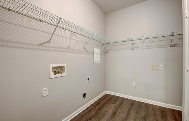 a bedroom with a closet and a wire shelving unit