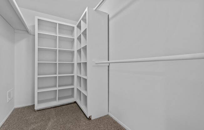 the closet in a small apartment with white shelves and a white wall at Edge At Farmington Hills - Farmington Hills, MI, Michigan, 48334