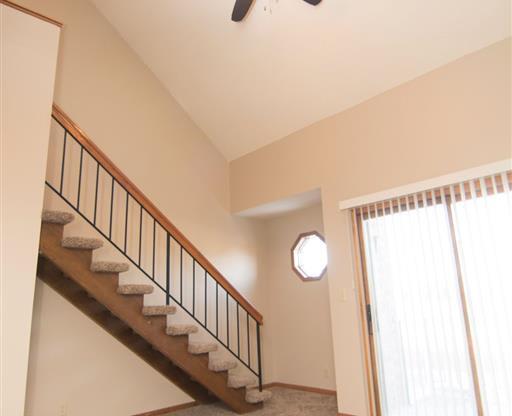 interior and stairs with ceiling fan at Fountain Glen Apartments in Lincoln Nebraska