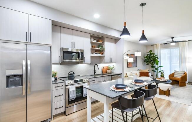 Modern kitchens feature stainless steel appliances, quartz countertops, and oversized islands perfect for entertaining or casual dining.