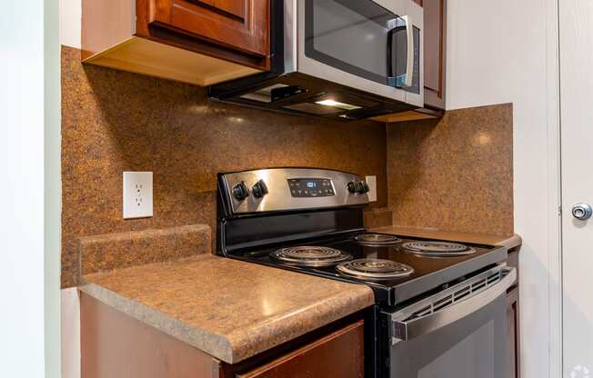 a kitchen with a stove and a microwave