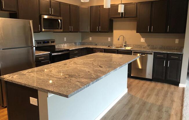 a modern kitchen with stainless steel appliances