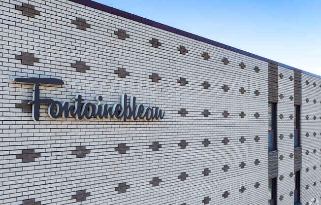 The brick wall has a sign that says "Fortune Plaza".