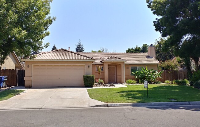 Big backyard on this NW home, Central Unified Schools. Close to shopping and HWY 99.