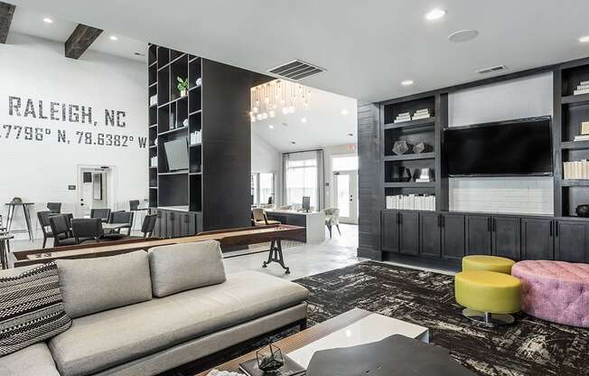 a living room with a couch and a coffee table and a television