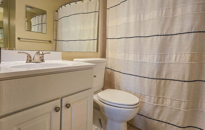 a bathroom with a toilet and a sink