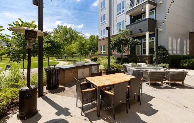 a patio with a table and chairs and a hot tub at Abberly Noda Vista Apartment Homes, Charlotte, NC, 28206