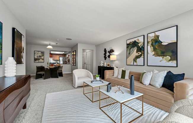A living room with a white sofa and a coffee table.