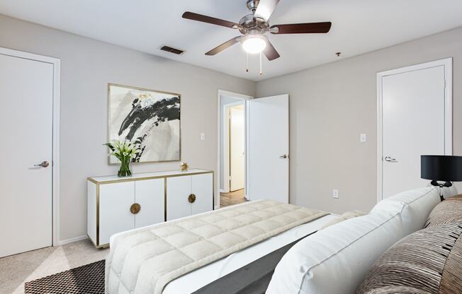 a spacious bedroom with a ceiling fan at avenues of kennesaw