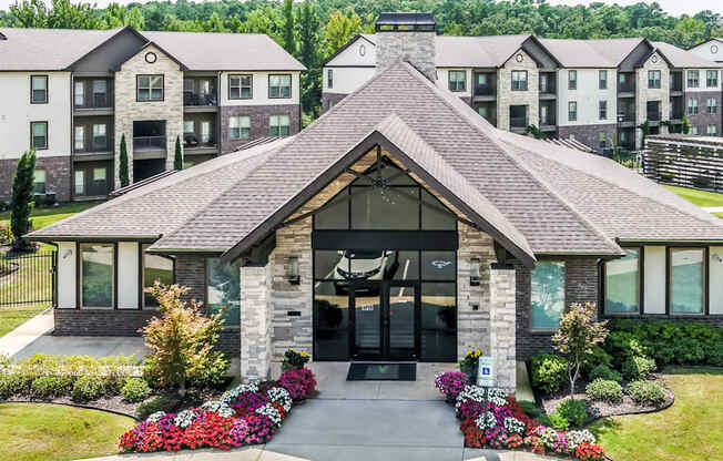 the front of a building with apartments in the background