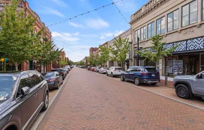 Brick paved street with string lights in downtown Greer, SC