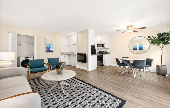 Apartments for Rent in Marina Del Rey, CA - Casa De Marina - Living Room with Grey Couch, Circle Coffee Table, Matching Chairs, and Wood-Style Floors