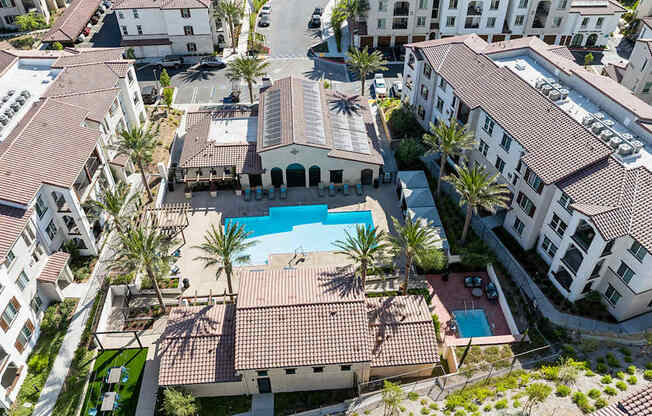 A bird's eye view of a resort with a swimming pool.