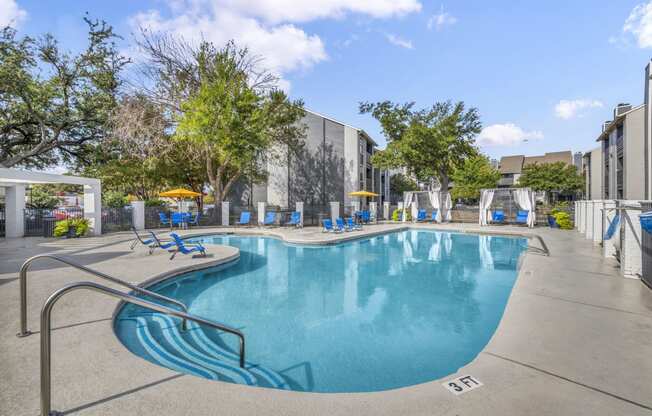 the swimming pool at the enclave apartments