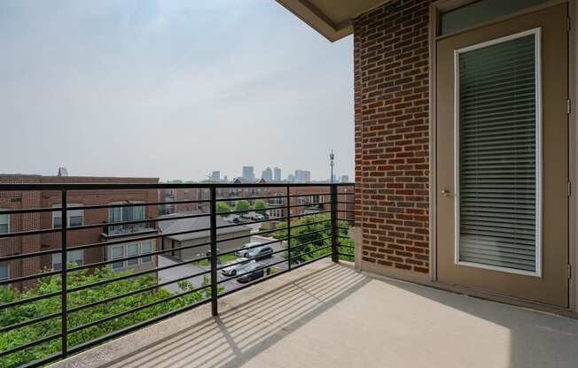 a balcony with a view of the city