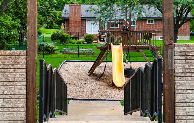 a playground with a slide in a park