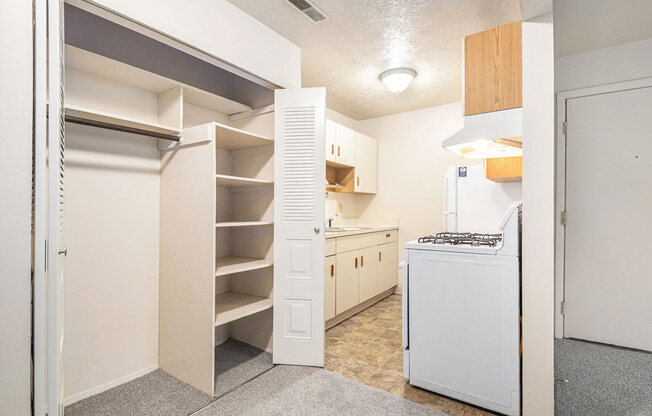 a kitchen with white appliances and a white stove top oven