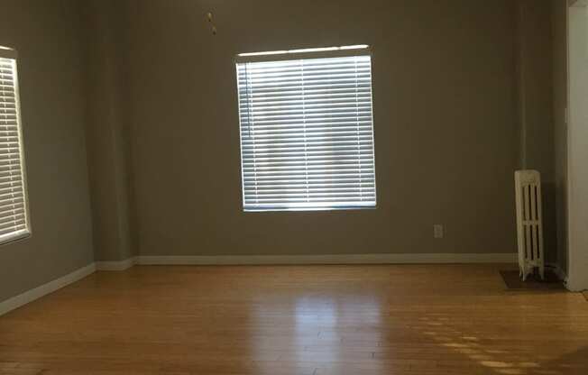 Empty Living room with hardwood floors and window