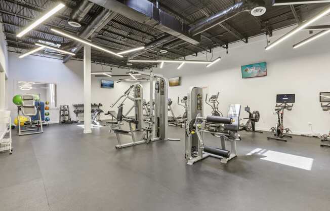 the gym at the community center with weights and exercise equipment