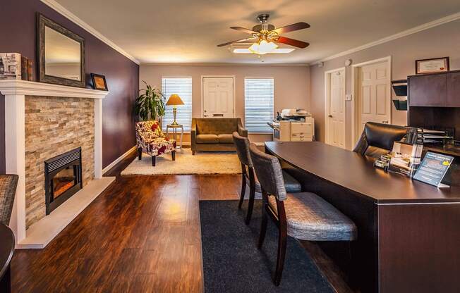 a living room with a fireplace and a dining table