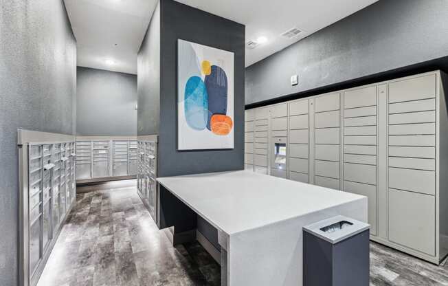 a spacious package locker with white cabinets and a colorful painting on the wall