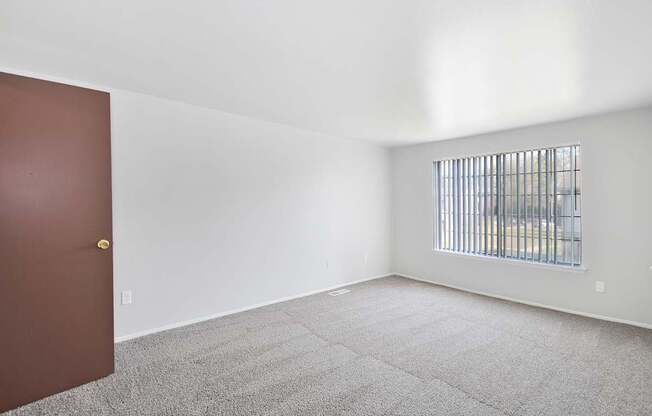 Comfortable bedroom with ample closet space at Farmbrooke Manor Apartments Clinton Township MI