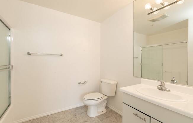 Bathroom with White Cabinets and Bathtub/Shower