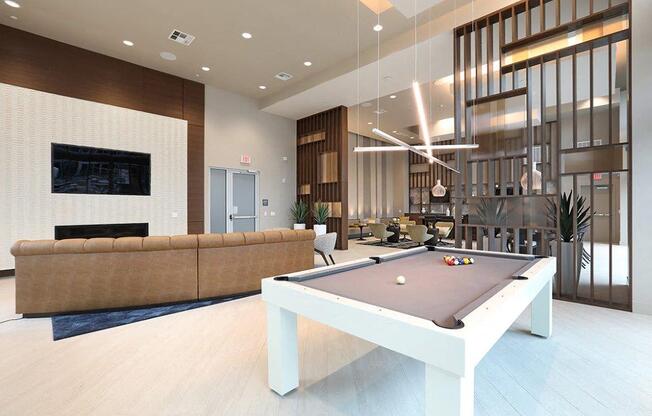 a pool table in the center of a living room