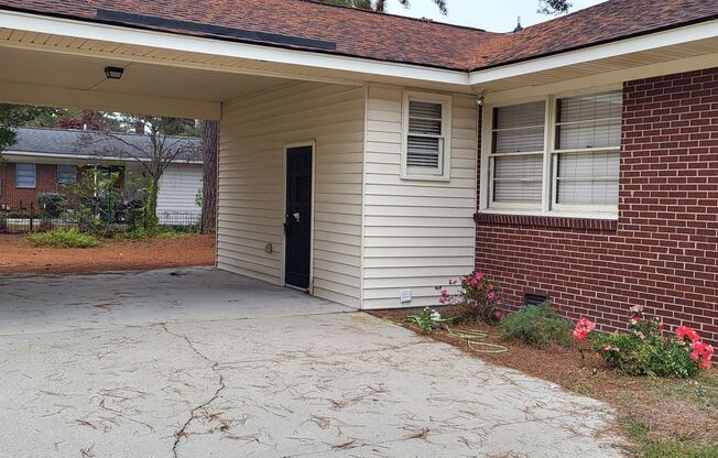 3 Bedroom 1 1/2 Bath Ranch style brick home with attached carport.