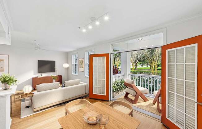 Enders Place - Updated model apartment dining room and living room with double entry doors to patio