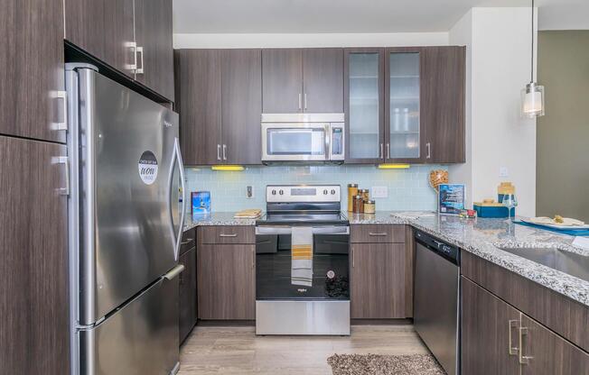 a large kitchen with stainless steel appliances