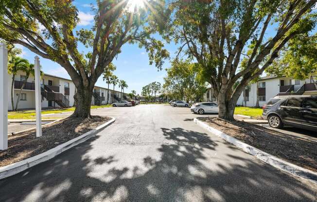 a street with houses and trees on both sides of it