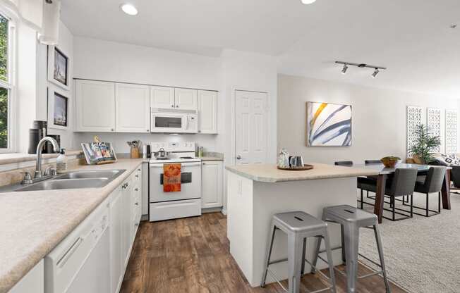 a kitchen and dining area in a 555 waverly unit