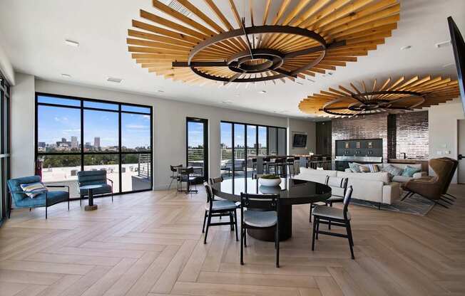 A modern living room with a large wooden chandelier.