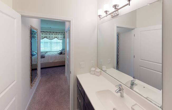 Upscale bathroom featuring quartz countertops