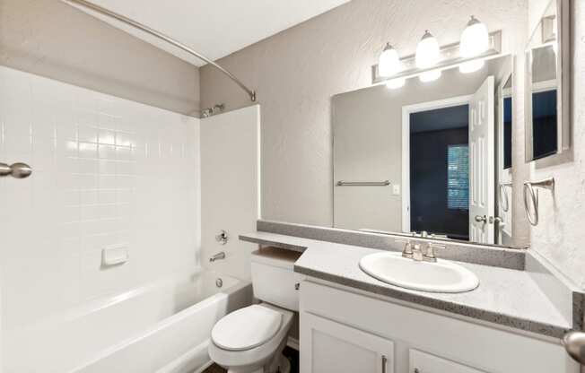 the preserve at ballantyne commons apartment bathroom with tub and sink