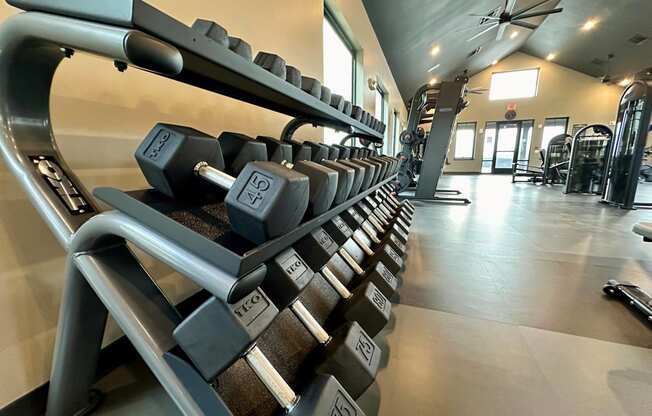 a row of dumbbells in a gym at The Depot, Raymore, 64083