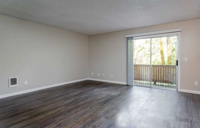 Vantage at Hillsdale | #3 Spacious Living Room, Plank Style Flooring and Entrance to Patio