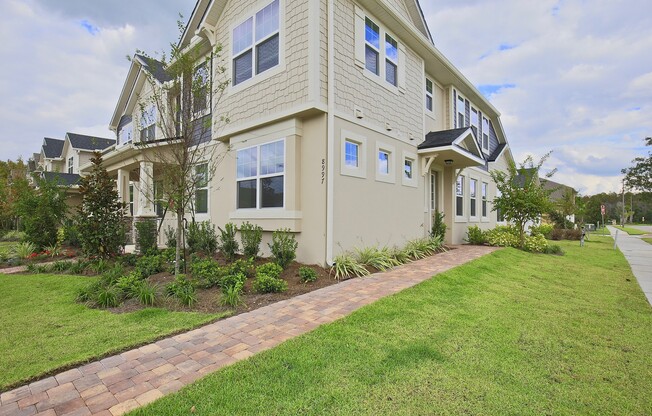 Beautifully Appointment 3/2 Modern Townhome with a Paved Courtyard and a Detached 2 Car Garage in the Desirable Community of Randal Park - Orlando!