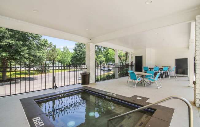 pool and patio at the whispering winds apartments in pearland, tx