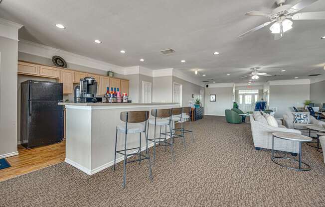 A kitchen with a bar area and a dining table.
