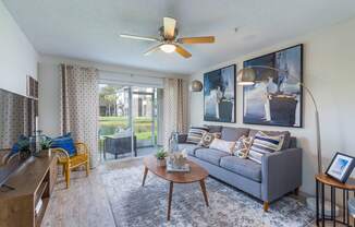 our apartments offer a living room with a couch coffee table and a tv