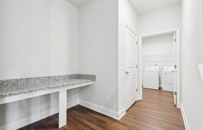 A laundry room with a washer and dryer.