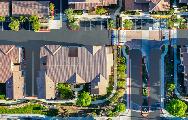 an aerial view of a neighborhood with houses and trees