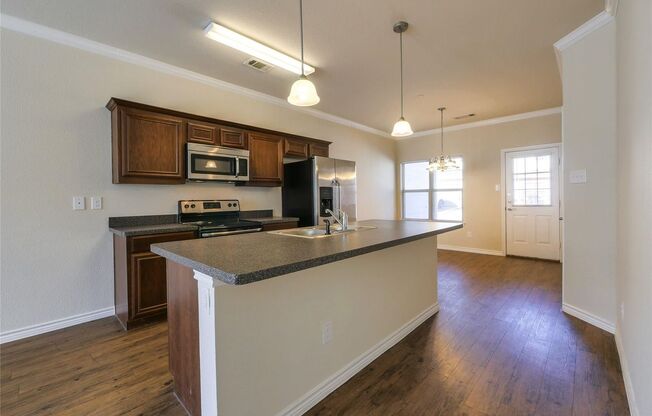 MOVE-IN SPECIAL! Spacious 4-Bedroom Townhome! This beautiful 4 bedroom, 2.5 bathroom townhome offers an open-concept layout designed for modern living.