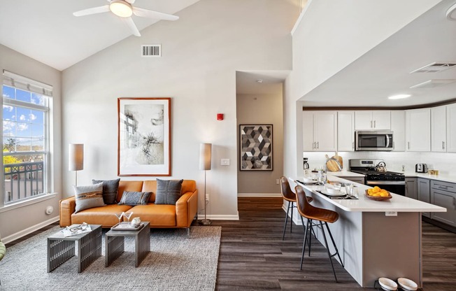 our apartments offer a living room with a couch a coffee table and a kitchen with a breakfast at Metro 303, Hempstead New York