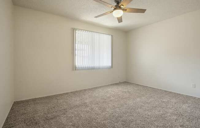 Bedroom with carpeted flooring, and ceiling fan