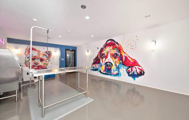 a hospital room with two large paintings of dogs on the wall at Track 281 Apartments, Sacramento, CA, 95811