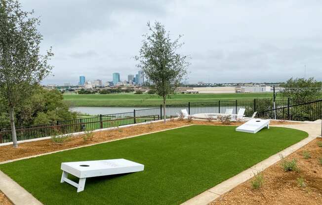 Presidio at River East Outdoor Corn Hole with View of Downtown