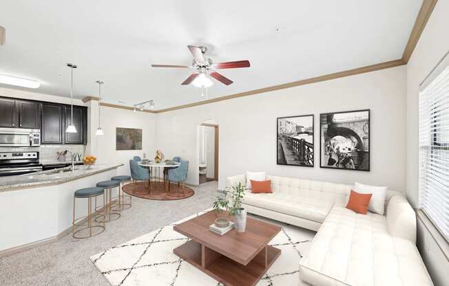 A living room with a white couch and a coffee table.
